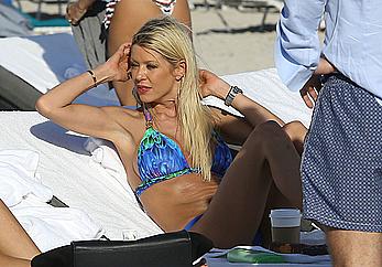 Tara Reid cleavage and cameltoe in bikini in Miami