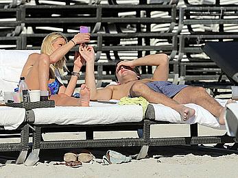 Tara Reid cleavage and cameltoe in bikini in Miami