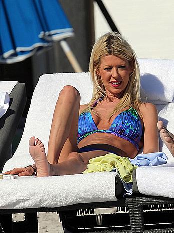 Tara Reid cleavage and cameltoe in bikini in Miami