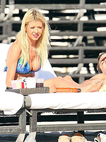 Tara Reid cleavage and cameltoe in bikini in Miami