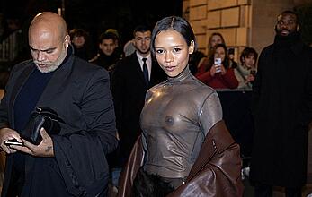 Taylor Russell braless in a see through top leaving her hotel in Paris