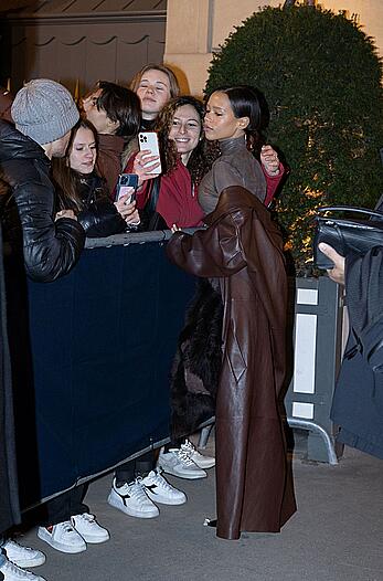 Taylor Russell braless in a see through top leaving her hotel in Paris