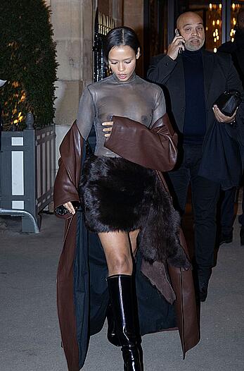 Taylor Russell braless in a see through top leaving her hotel in Paris