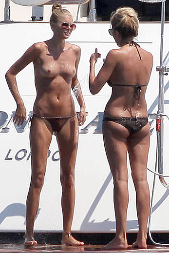 Toni Garrn in bikini and topless on a yacht in Ibiza