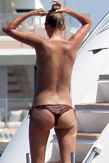 Toni Garrn in bikini and topless on a yacht in Ibiza