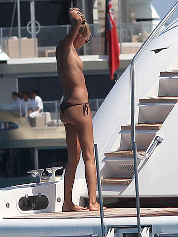 Toni Garrn in bikini and topless on a yacht in Ibiza