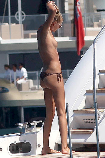 Toni Garrn in bikini and topless on a yacht in Ibiza