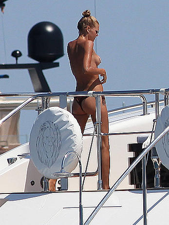 Toni Garrn in bikini and topless on a yacht in Ibiza