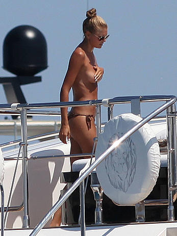 Toni Garrn in bikini and topless on a yacht in Ibiza