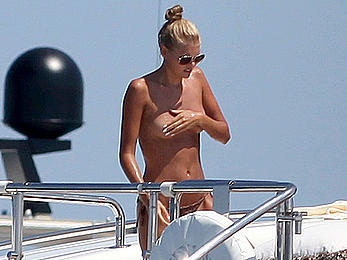 Toni Garrn in bikini and topless on a yacht in Ibiza