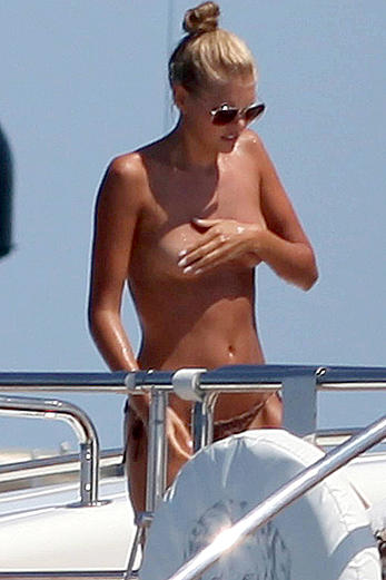 Toni Garrn in bikini and topless on a yacht in Ibiza