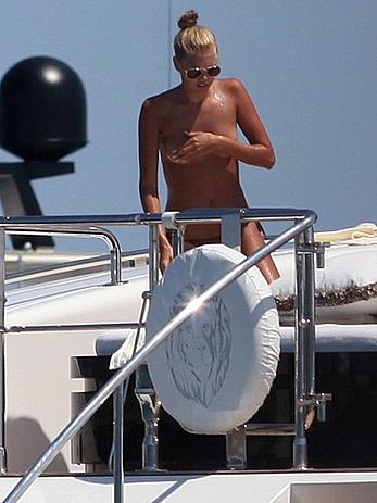 Toni Garrn in bikini and topless on a yacht in Ibiza