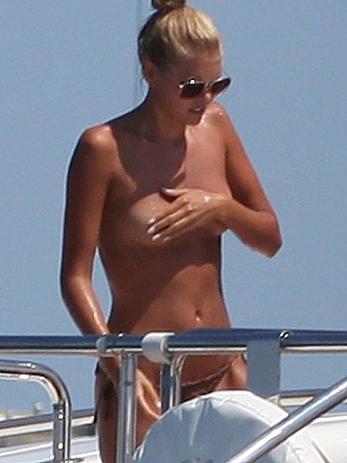 Toni Garrn in bikini and topless on a yacht in Ibiza