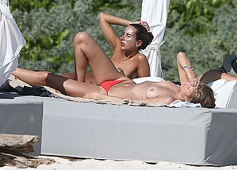 Toni Garrn sunbathing topless on the beach in Miami