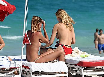 Toni Garrn topless on a beach in Miami