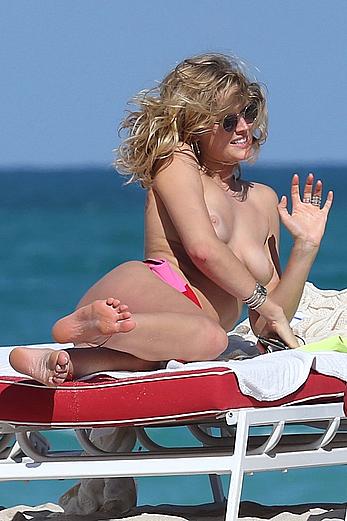 Toni Garrn topless on a beach in Miami