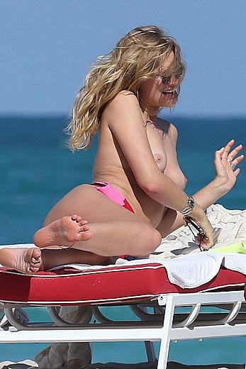 Toni Garrn topless on a beach in Miami