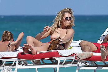 Toni Garrn topless on a beach in Miami