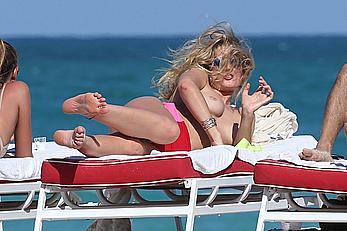 Toni Garrn topless on a beach in Miami