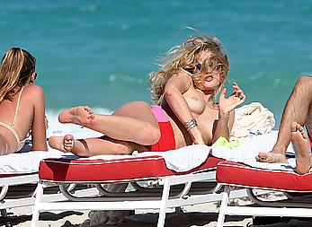 Toni Garrn topless on a beach in Miami