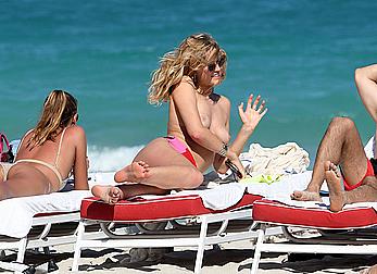 Toni Garrn topless on a beach in Miami