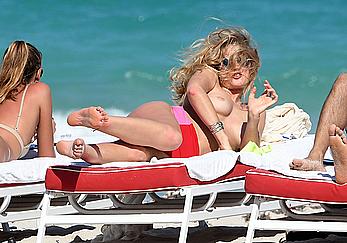 Toni Garrn topless on a beach in Miami