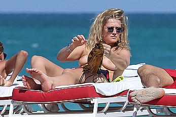 Toni Garrn topless on a beach in Miami