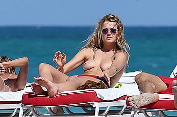 Toni Garrn topless on a beach in Miami