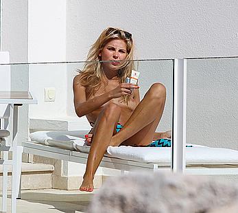 Australian model Jessica Hart sunbathing topless at Eden Roc hotel in Antibes