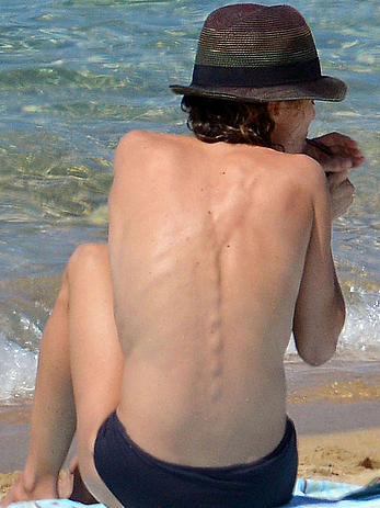 Vanessa Paradis sunbathing topless on the beach in Corsica