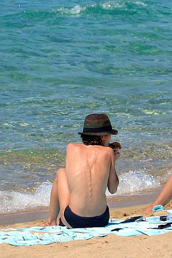 Vanessa Paradis sunbathing topless on the beach in Corsica