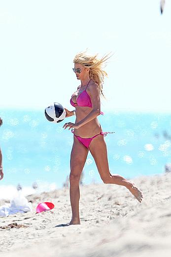 Victoria Silvstedt in pink bikini enjoys and relaxes in the sun at Miami Beach