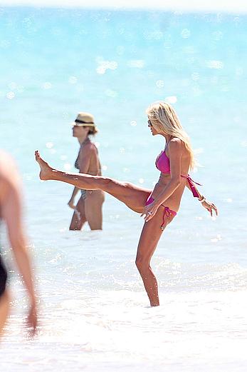 Victoria Silvstedt in pink bikini enjoys and relaxes in the sun at Miami Beach