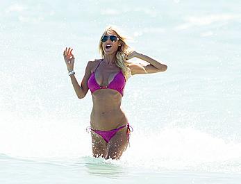 Victoria Silvstedt in pink bikini enjoys and relaxes in the sun at Miami Beach