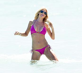 Victoria Silvstedt in pink bikini enjoys and relaxes in the sun at Miami Beach