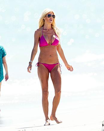 Victoria Silvstedt in pink bikini enjoys and relaxes in the sun at Miami Beach