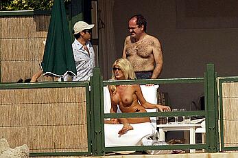 Vistoria Silvstedt sunbathing topless on a beach paparazzi photos