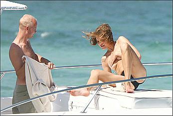 Natalia Vodianova sunbathing topless on a yacht in St Barth