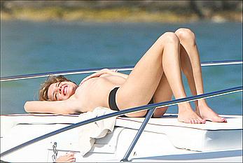 Natalia Vodianova sunbathing topless on a yacht in St Barth