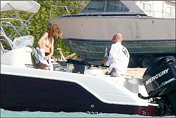 Natalia Vodianova sunbathing topless on a yacht in St Barth