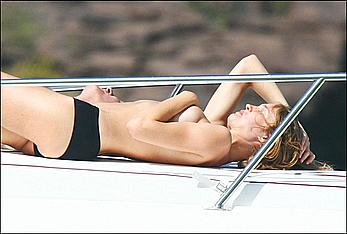 Natalia Vodianova sunbathing topless on a yacht in St Barth