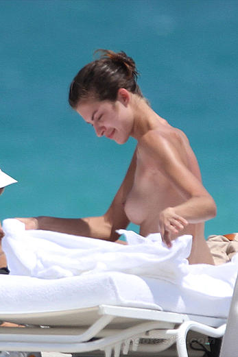 Supermodel Yaya Kosikova caught topless on the beach in Miami