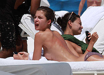 Supermodel Yaya Kosikova caught topless on the beach in Miami