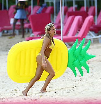 Zara Holland sexy in yellow bikini in Barbados