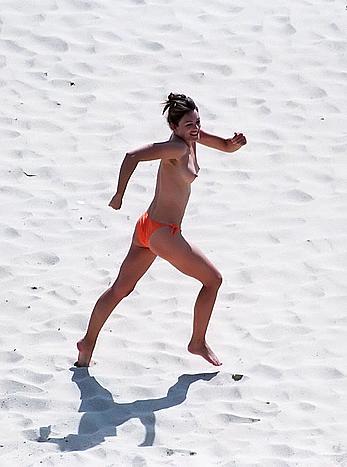 Elizabeth Hurley topless on a beach paparazzi shots