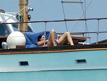 Manuela Arcuri sunbathing topless on a yacht