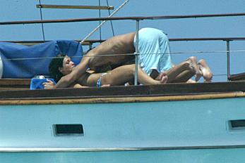 Manuela Arcuri sunbathing topless on a yacht