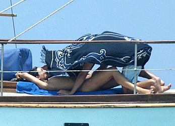 Manuela Arcuri sunbathing topless on a yacht