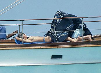 Manuela Arcuri sunbathing topless on a yacht