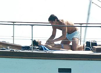 Manuela Arcuri sunbathing topless on a yacht